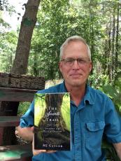 Mike “MJ” Gaylor showcases his novel. He will have a booth at the Callahan Community Market Saturday, 10 a.m. to 2 p.m. at the Callahan Depot. Photo by Lorelai Bryan Photography