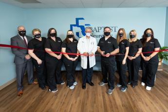 The staff at Baptist Neurology Group at Baptist Medical Center Nassau celebrates the opening of the new neurological care center during a recent ribbon cutting. From left are Baptist Neurology Group director Jason Kimball, medical assistant Jodi Tauscher-Robinson, referral coordinator Caitlin Kremler-Kuhl, medical assistant Cassidy Clay, Dr. Michael Gebel, Dr. Timothy Lucey, officer manager Kris Lucey, office specialist Jill VanBeek and office specialist Yvonne Foster.