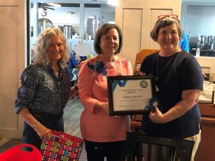 Nassau County Retired Educators Association Volunteer Coordinators Elaine Rafter, from left, and Barbara Leech present the Volunteer of the Year Award to Stephanie Manwell for outstanding service to the community.