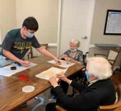 Yulee Middle’s Asher Conway spends time with assisted living residents at Osprey Village.