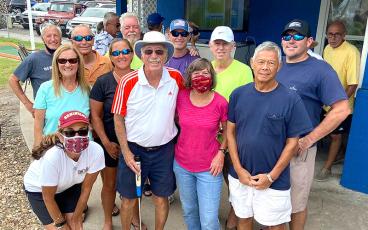 Jim Last had lots of support from his pickleball family during the 61st annual Professional Putters Association Championship week on Amelia Island. Pictured are, front row from left, Cyndi Teitelbaum, Last, Mary Jean Last, Ed Eng; second row, Chmone Ashley, Cyndi Roberts, Art Nichols, Chris Gamble; third row, Kevin O’Connor, Steve Ashley, Dan Broome, Gary Calhoun; and, far back right, PPA Commissioner Joe Aboid. SUBMITTED PHOTO