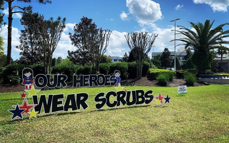 The Sign Gypsies in St. Marys helped put words to what many in Camden County are feeling toward the healthcare workers who selflessly come to work each day to tend to the health and well-being of others — “Our Heroes Wear Scrubs.” 