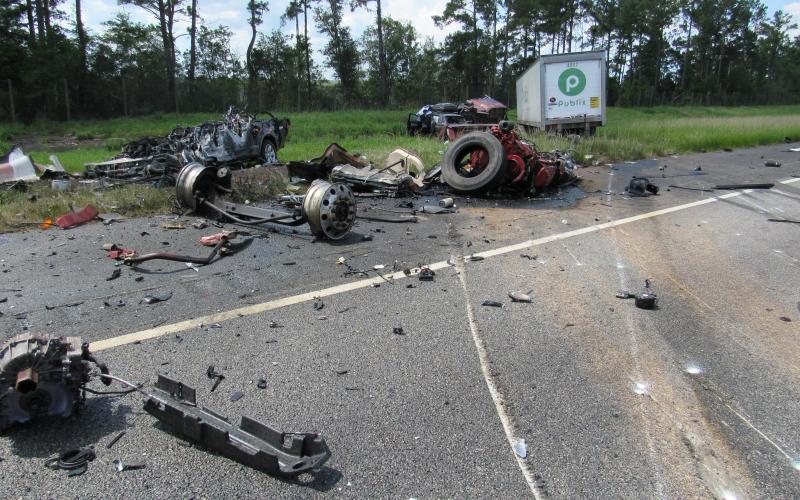 Debris from a Saturday afternoon crash litters the roadway. 