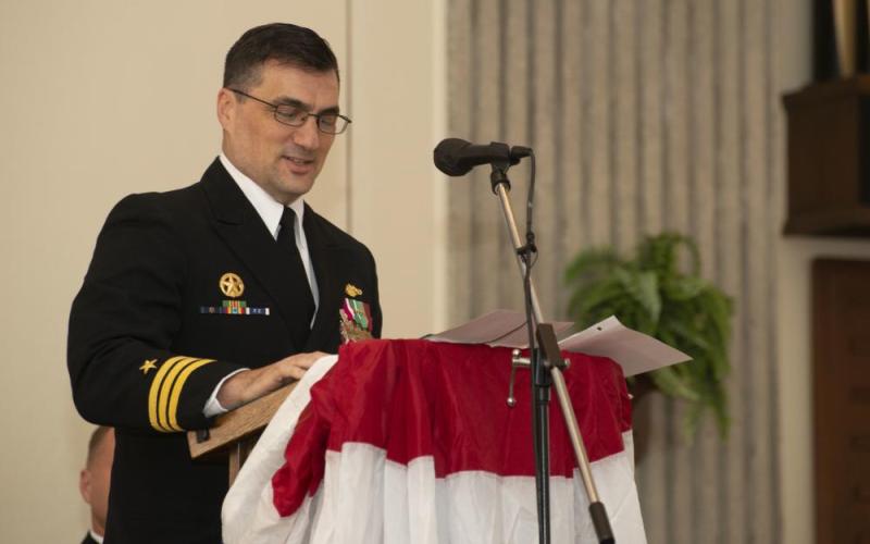 Cmdr. Joseph Pisoni, outgoing commanding officer of the Ohio-class ballistic-missile submarine USS West Virginia (SSBN 736) Blue Crew, speaks to distinguished guests, family and crew during a change of command ceremony at the chapel onboard Naval Submarine Base Kings Bay.