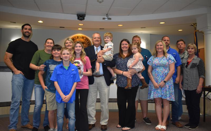 New St. Marys Chief of Police James Galloway celebrates his hire with his family at the St. Marys City Council meeting Monday.