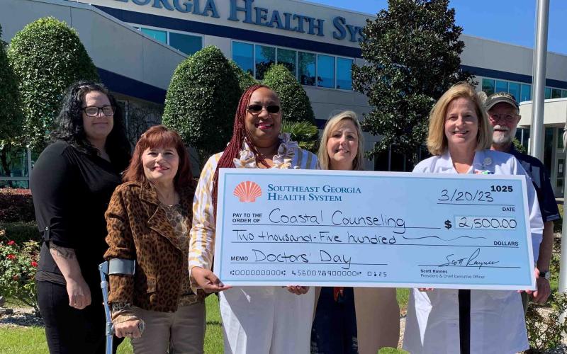 Southeast Georgia Health System Camden Campus Medical Staff Chief Dr. Janise H. Whitesell delivers a $2,500 donation to Coastal Counseling Center and its staff members, Merrisa Kight, Nannette Brannon, Leticia Graham, Tammy Hudson and Dale Blanton.