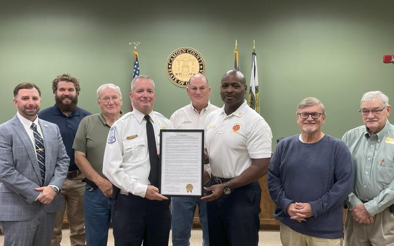 Administrator Shawn Boatright, Camden County Commissioners Trevor Readdick and Lannie Brant, Fire Safety Specialist Lt. Chris Goebel, Camden County Board of Commissioners Chairman Ben Casey, Fire Chief Terry Smith, and Commissioners Martin Turner and Commissioner Jim Goodman celebrate Fire Prevention Week.
