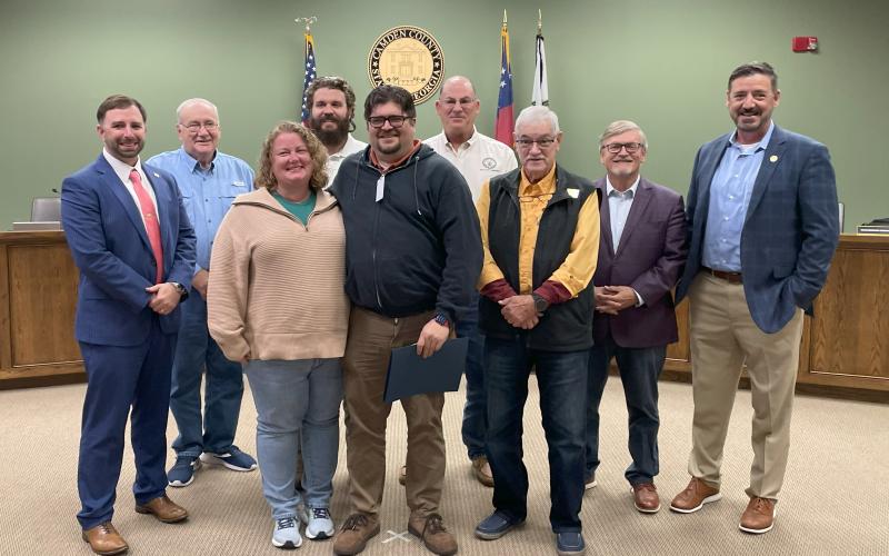 The Camden County Board of Commissioners recently honored Scott Van Osdol as its Employee of the Quarter. From left are County Administrator Shawn Boatright, Commissioner Lannie Brant, Leigh Van Osdol, Commissioner Trevor Readdick, Scott Van Osdol, Chairman Ben Casey, Commissioners Jim Goodman and Martin Turner, and Senior Director of Human Resources and Risk Management Mike Spiers.