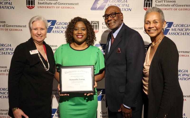Woodbine city Administrator Samantha H. Young recently received the Harold F. Holtz Municipal Training Institute Certificate of Achievement. From left are Carl Vinson Institute Director of Governmental Training Mara Shaw, Young, Georgia Municipal Association First Vice President Fred Perriman and association Training Board member Linda Davis.