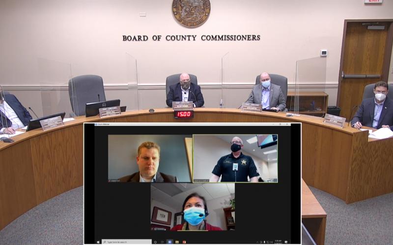 Nassau County commissioners, including Aaron Bell via the Internet, listen to Nassau County Emergency Management Director Greg Foster provide an update on COVID-19 and vaccinations.