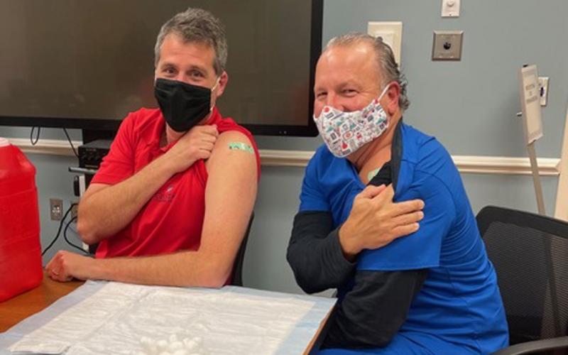 Dr. Alan Miller and physician assistant Keith Rawlinson, both with Coastal Spine and Pain Center, have received a first dose of the coronavirus vaccine. An additional vaccination will be administered 17 to 21 days after the first dose, and immunity takes at least seven days to take effect. ALAN MILLER