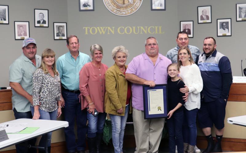 Hilliard Town Council President John Beasley is joined by family after receiving recognition for 20 years of service to the town. 