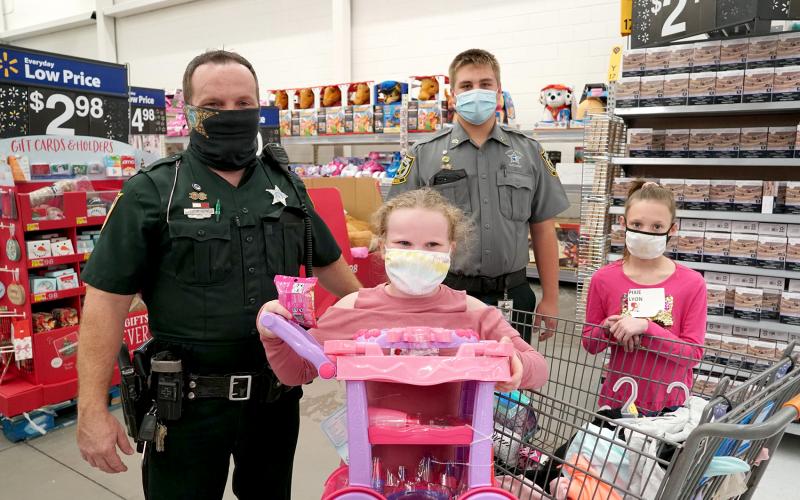 Deputies, Explorers and other members of the Nassau County Sheriff’s Office and various state agencies shop with 333 children during Nassau’s annual Shop with a Cop event. Children are identified based on need and then pair up with officers to shop for clothing, shoes and toys.