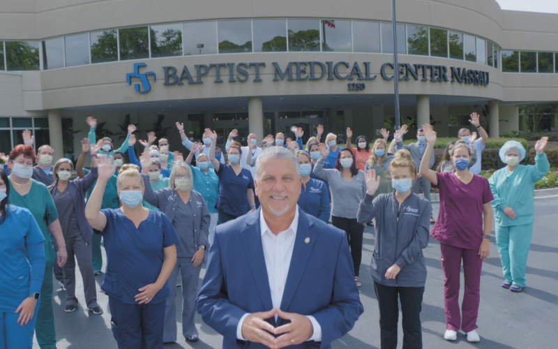 Baptist Medical Center Nassau President Ed Hubel stands with staff in front of the hospital.