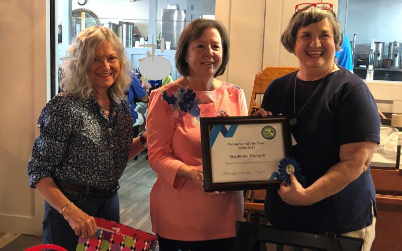 Nassau County Retired Educators Association Volunteer Coordinators Elaine Rafter, from left, and Barbara Leech present the Volunteer of the Year Award to Stephanie Manwell for outstanding service to the community.