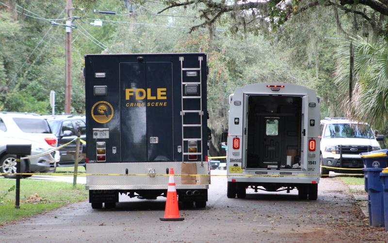 Fernandina Beach Police Department and Florida Department of Law Enforcement officials at the scene of a homicide Monday on S. 13th St. in Fernandina Beach.