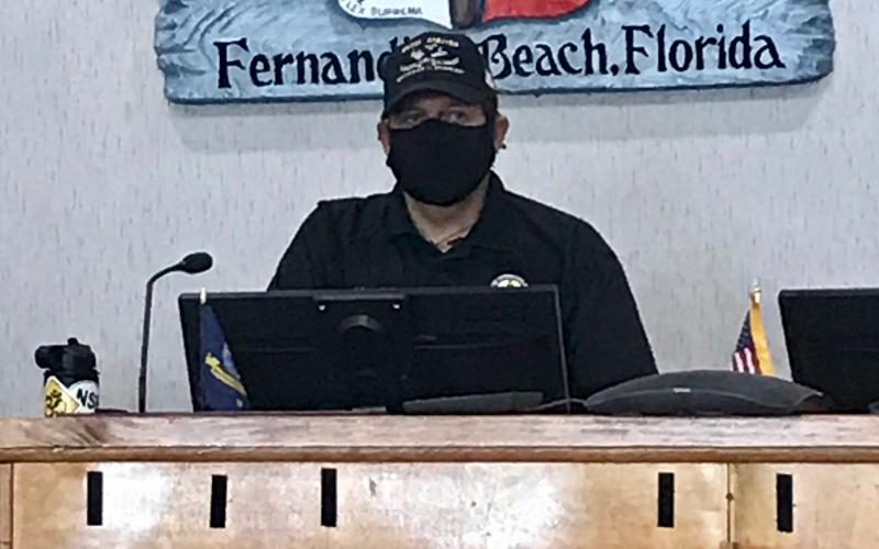 Mayor Johnny Miller of Fernandina Beach wears a mask at a special meeting called Thursday to discuss whether to mandate the wearing of masks in an attempt to slow the spread of the novel coronavirus.  Julia Roberts/News-Leader