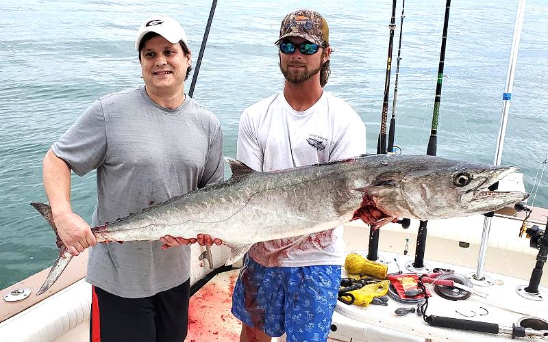 Cliff Baker and mate Trent Wainwright are pictured with Baker’s 48-pound kingfish caught aboard Capt. Allen Mill’s charter fishing boat, the Wahoo II, on Saturday. SPECIAL