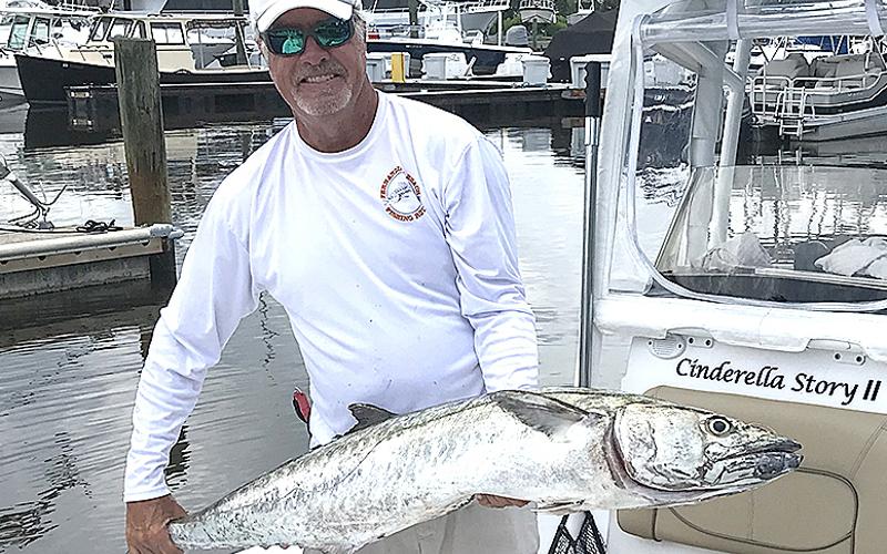 Brad Reese set a new Nassau Sport Fishing Association club record with this 37.12-pound kingfish. SPECIAL PHOTO