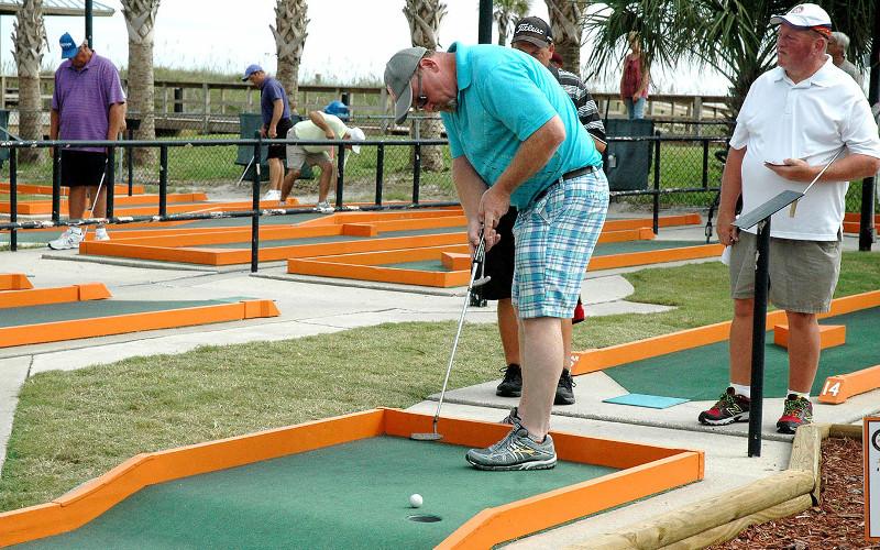Professional and amateur putters met at Putt-Putt at Main Beach in September 2015 to compete in the 56th annual Professional Putters Association national championship. The PPA returns Sept. 14 for the 61st annual national championship. Joe Lea, above right, won in 2015. More photos, 7B. BETH JONES/NEWS-LEADER