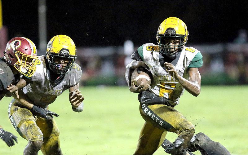Jalen Holmes carries the ball for the Yulee Hornets Friday in Callahan. BRIAN LACROSS/SPECIAL